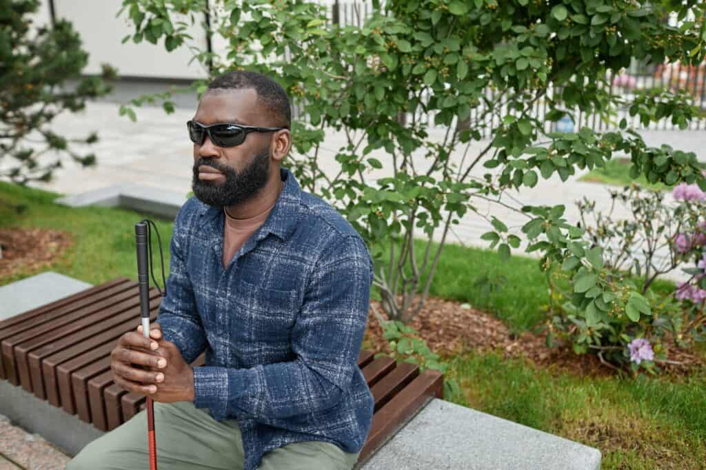 Blind African American Man in Park